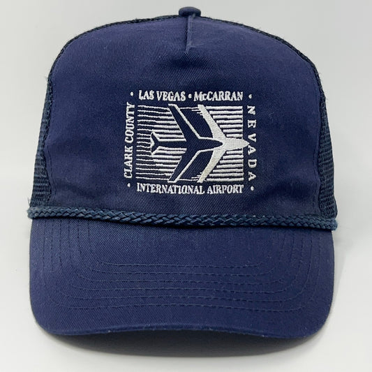 Vintage navy blue trucker hat featuring Las Vegas McCarran Airport logo with airplane design
