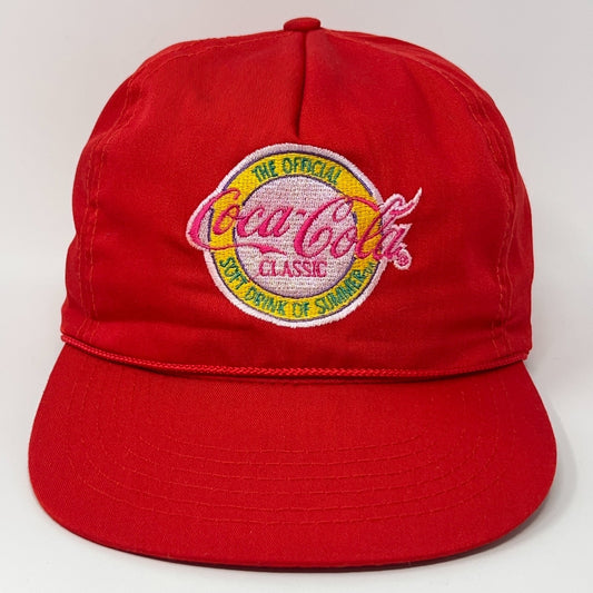 Front view of a red Coca Cola Hat with classic logo and embroidered details for summer style