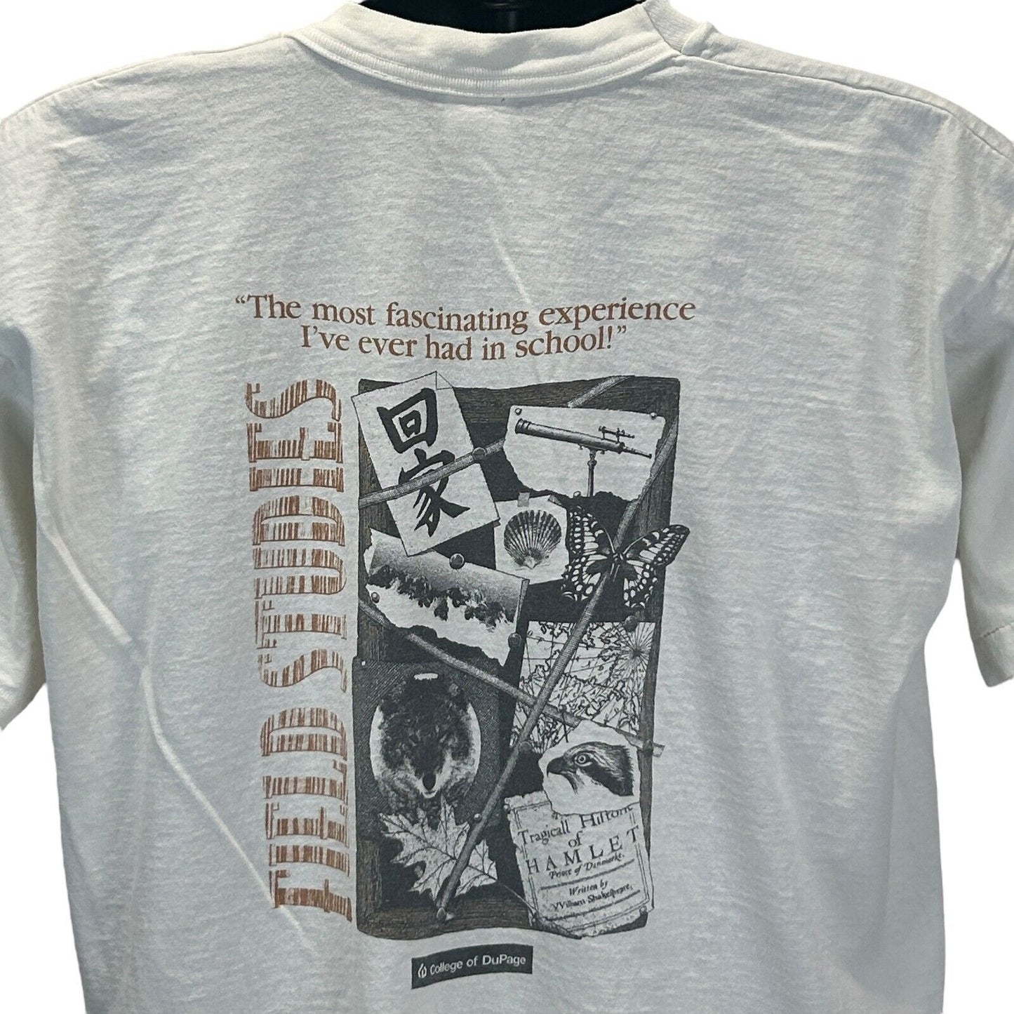 White Fruit of the Loom T-Shirt with College of Dupage graphic on back showcasing quotes and designs