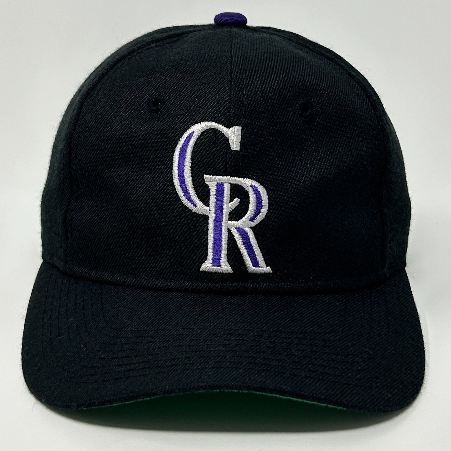 Black Colorado Rockies cap with embroidered CR logo, front view, adjustable fit for fans.