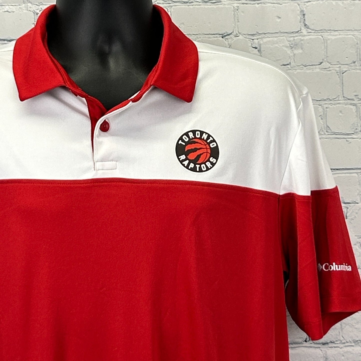 Red Columbia polo shirt with Toronto Raptors logo, featuring a front view and a sporty design.