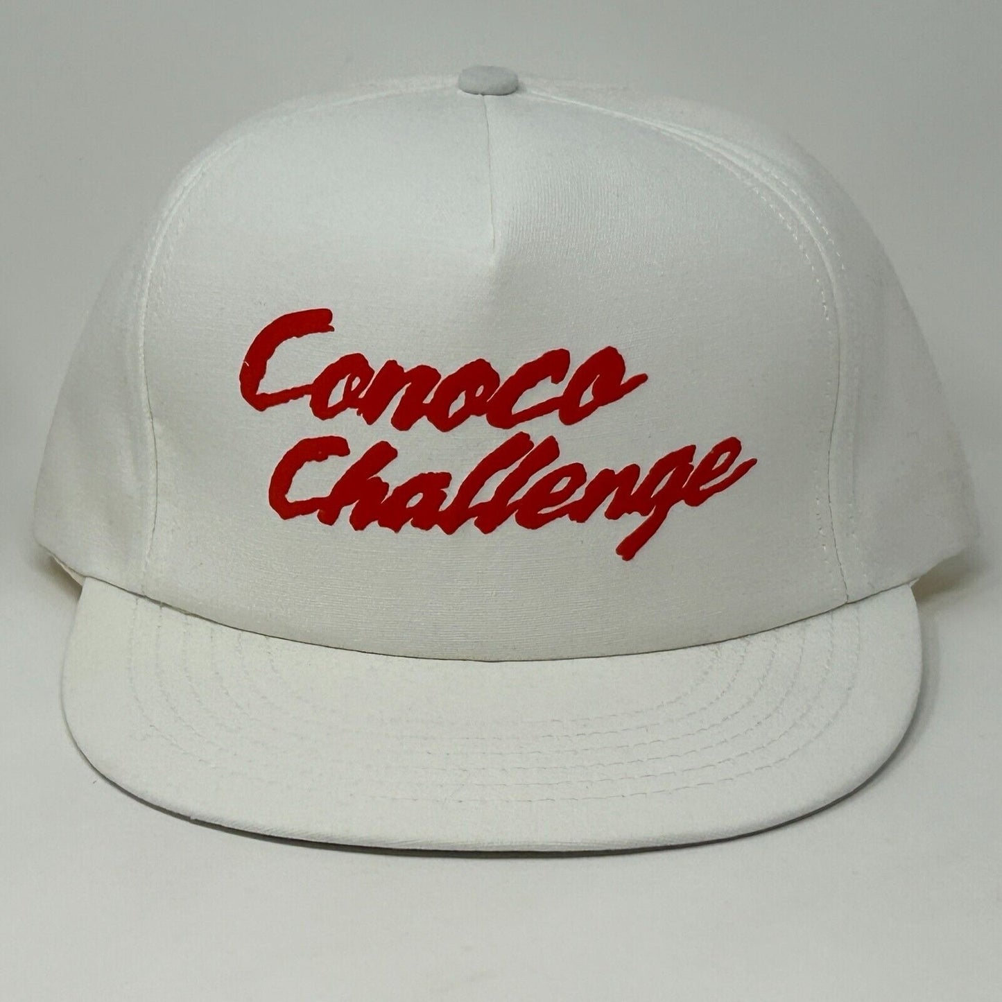 White Stylemaster hat with red Conoco Challenge logo, featuring a flat brim design for casual wear.