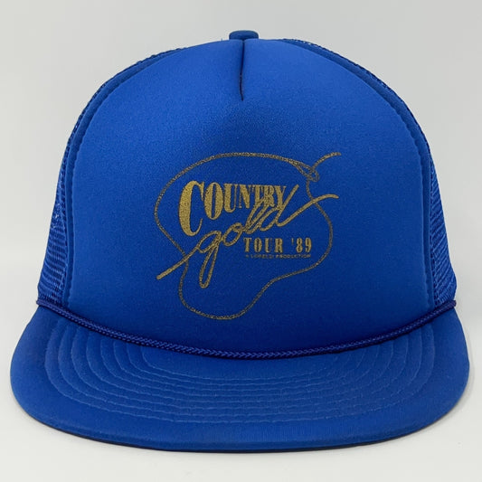 Front view of a blue vintage trucker cap hat featuring gold 'Country Gold Tour 89' logo