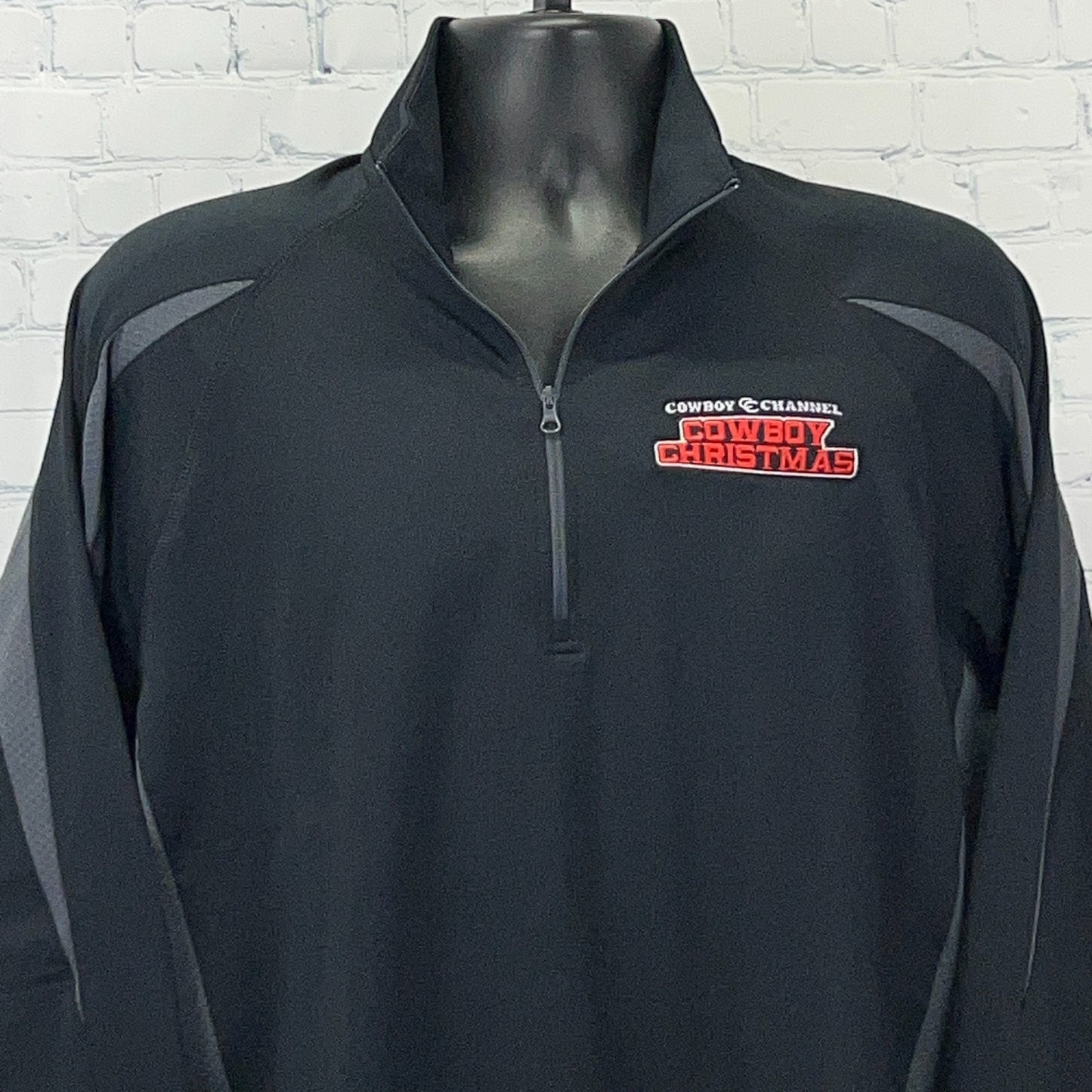 Black Sport-Tek Quarter-Zip Pullover featuring Cowboy Channel Cowboy Christmas logo on the front