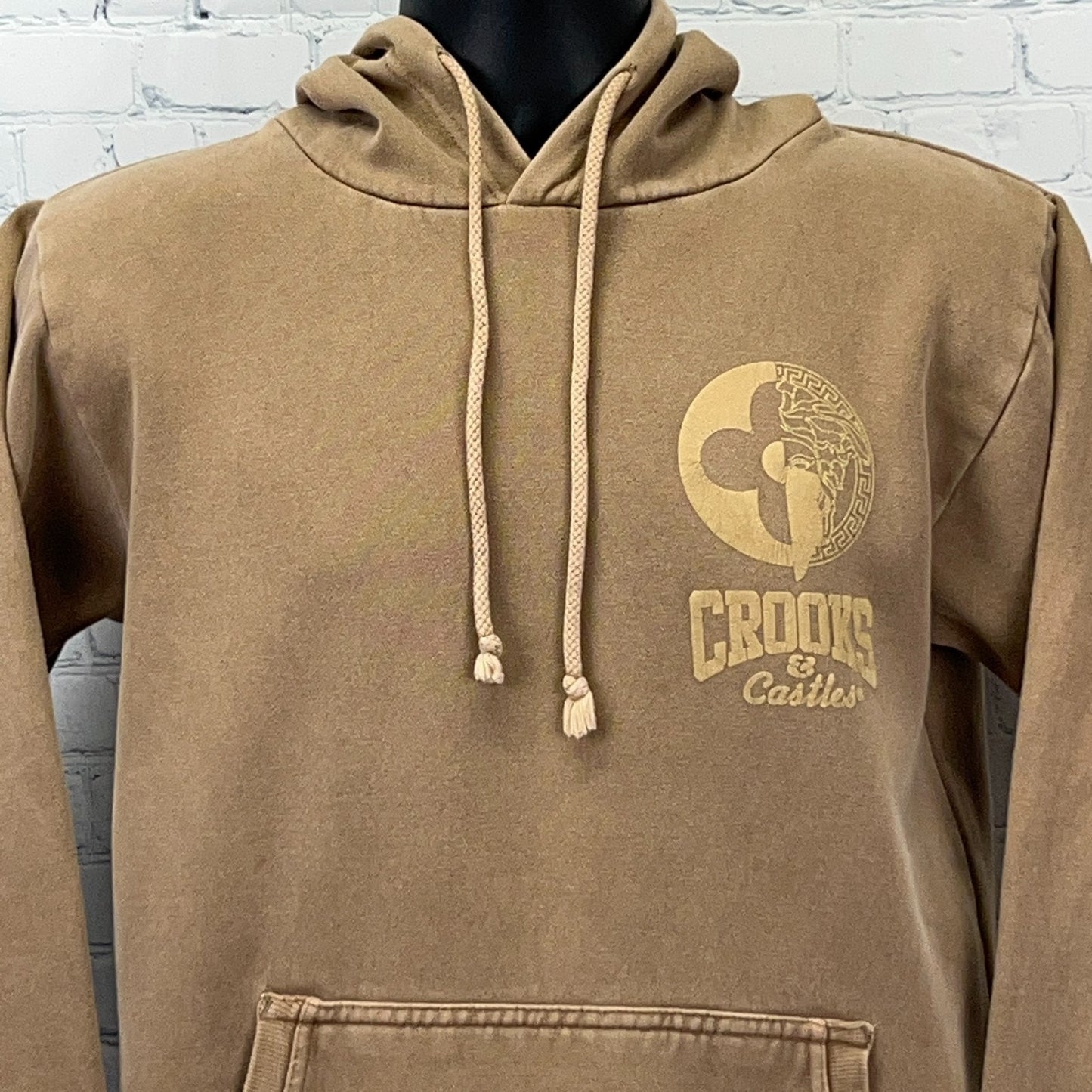Brown Crooks and Castles hoodie featuring a front logo and drawstring hood in a relaxed fit
