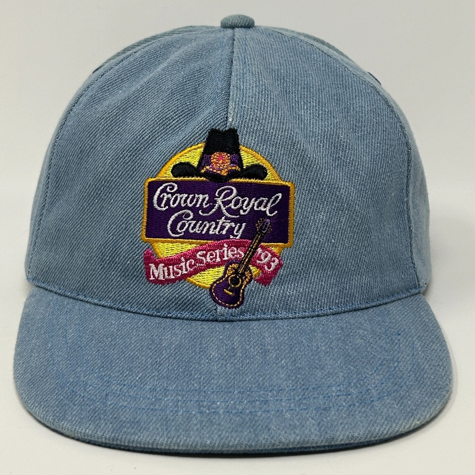 Front view of Vintage Country Music hat in light blue featuring embroidered logo and guitar design
