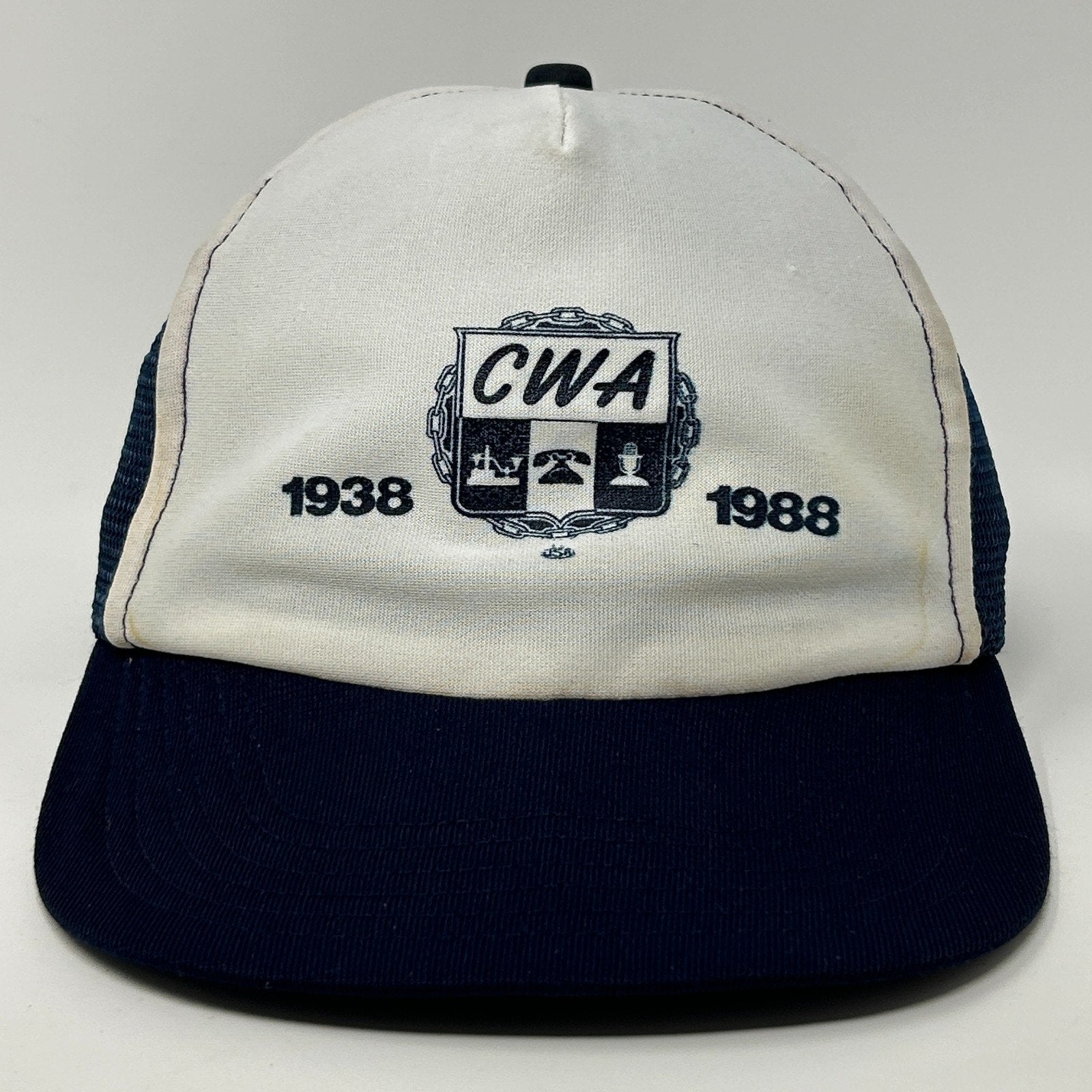 Vintage Trucker Hat in white and navy with CWA logo featuring 1938 and 1988 on the front