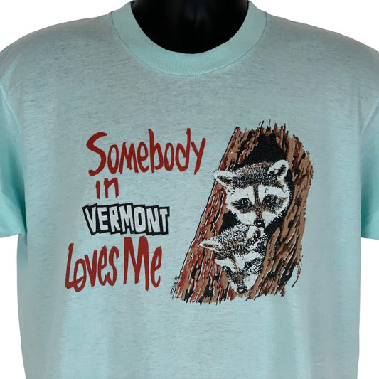 Camiseta vintage de mapaches de los años 80 con texto "Somebody In Vermont Loves Me" para hombre, color azul