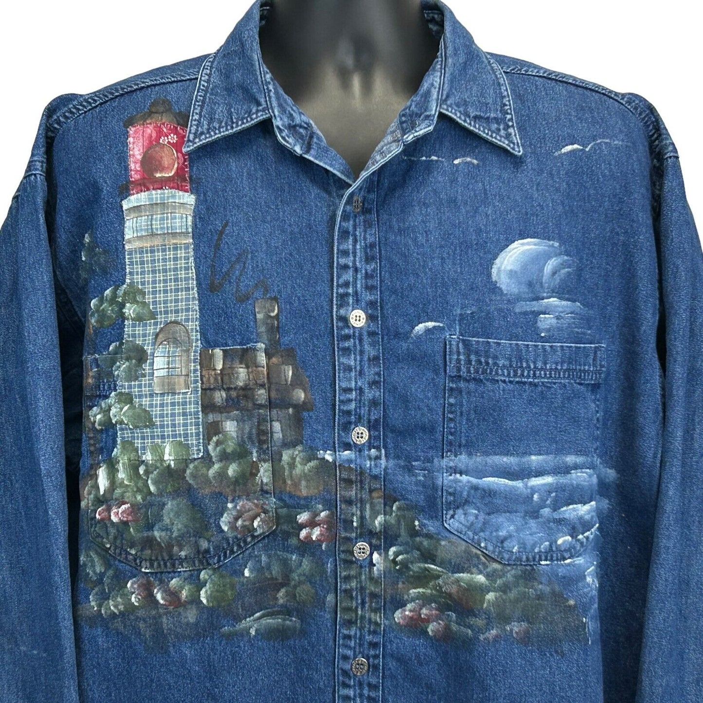 Vintage denim shirt featuring a painted lighthouse design, front view, with a classic fit and detailed artwork