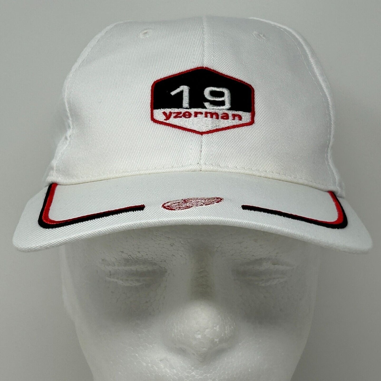 White Detroit Red Wings cap featuring Yzerman 19 logo on the front with red accents