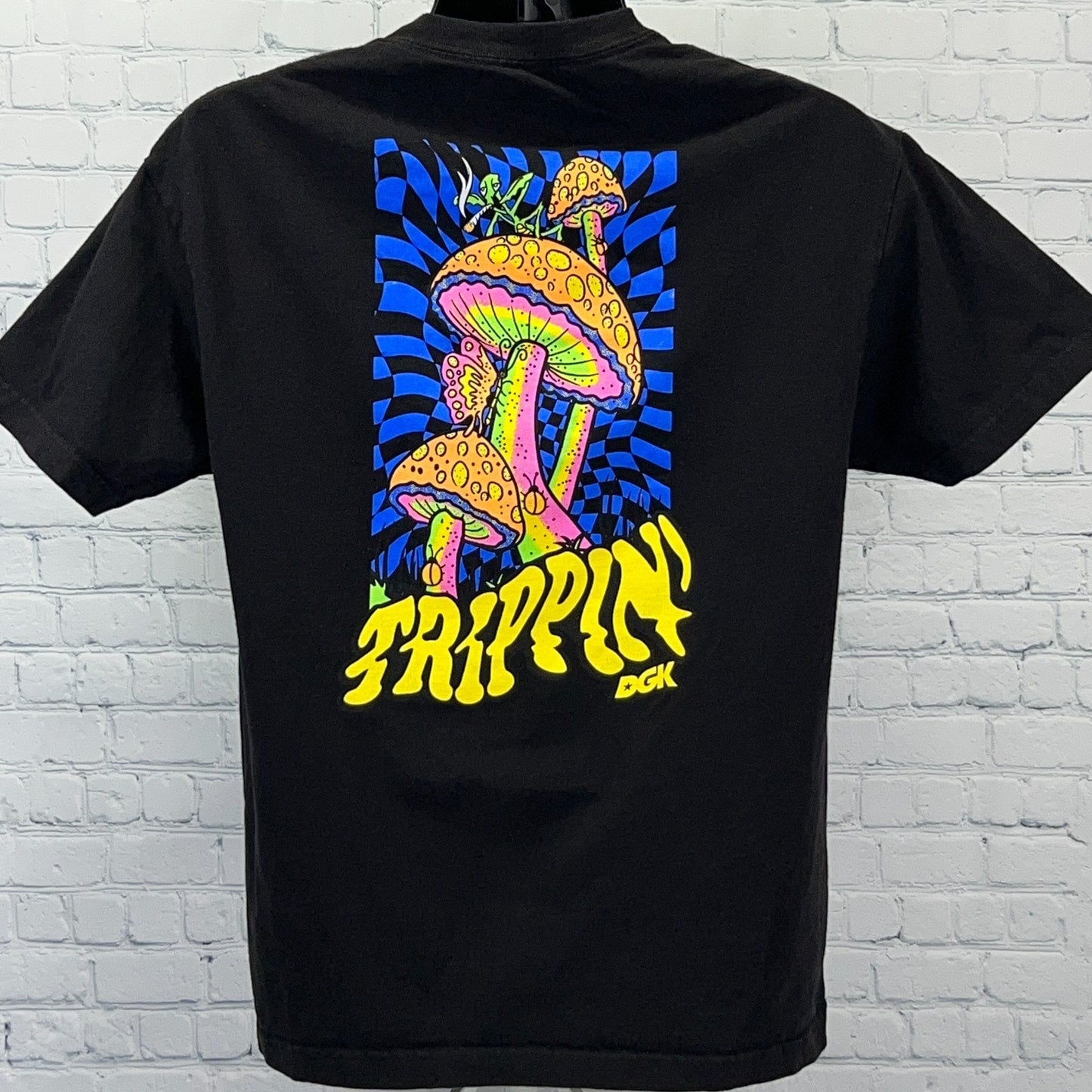 Black DGK T-shirt featuring vibrant mushroom graphic and 'Trippin' text on back