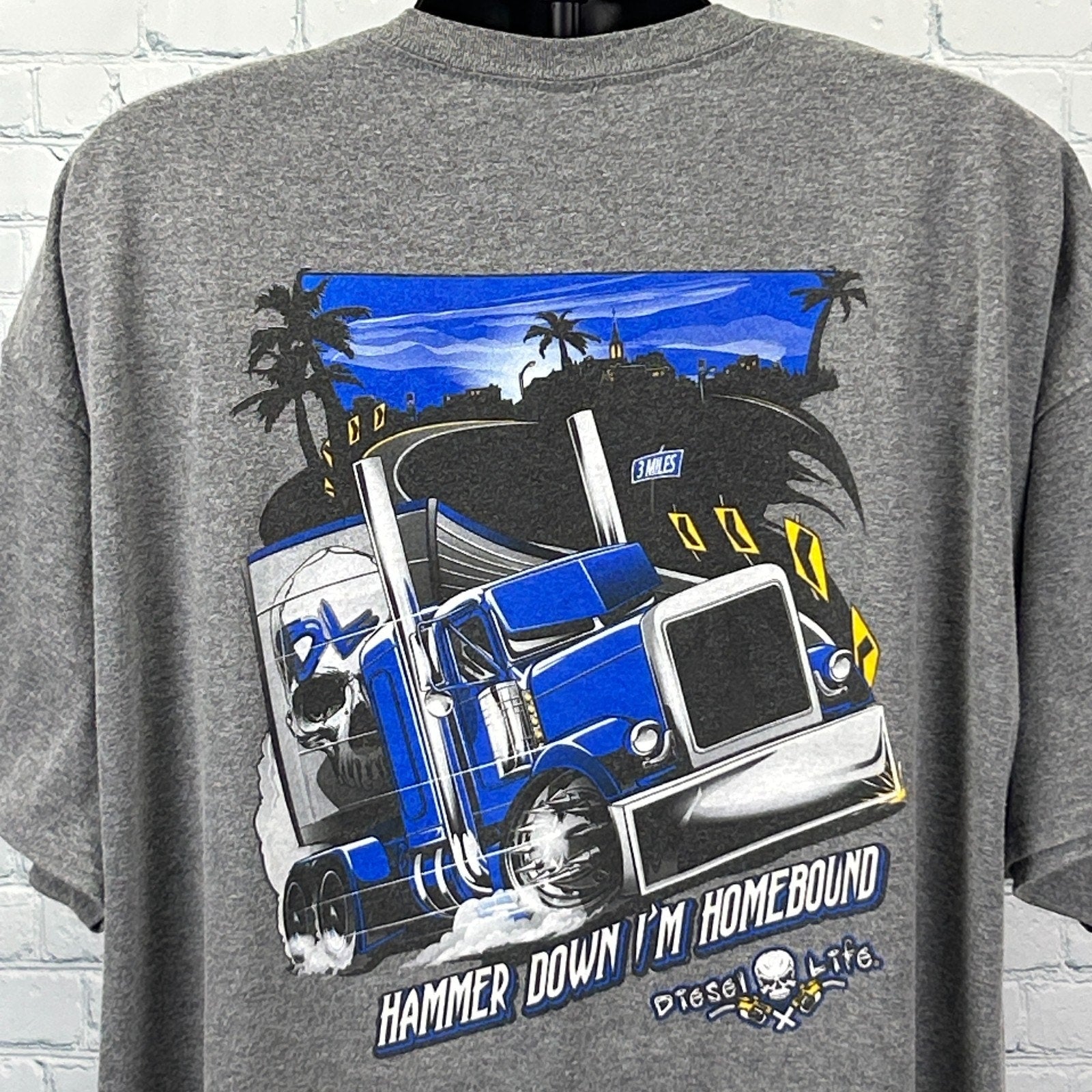 Gray Gildan Trucker T Shirt featuring a large truck graphic and 'Hammer Down I'm Homebound' text on the back