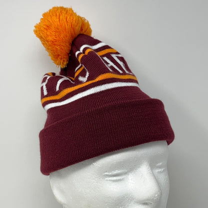 Maroon Dirty Heads beanie with orange pom-pom, featuring a striped design in white and yellow