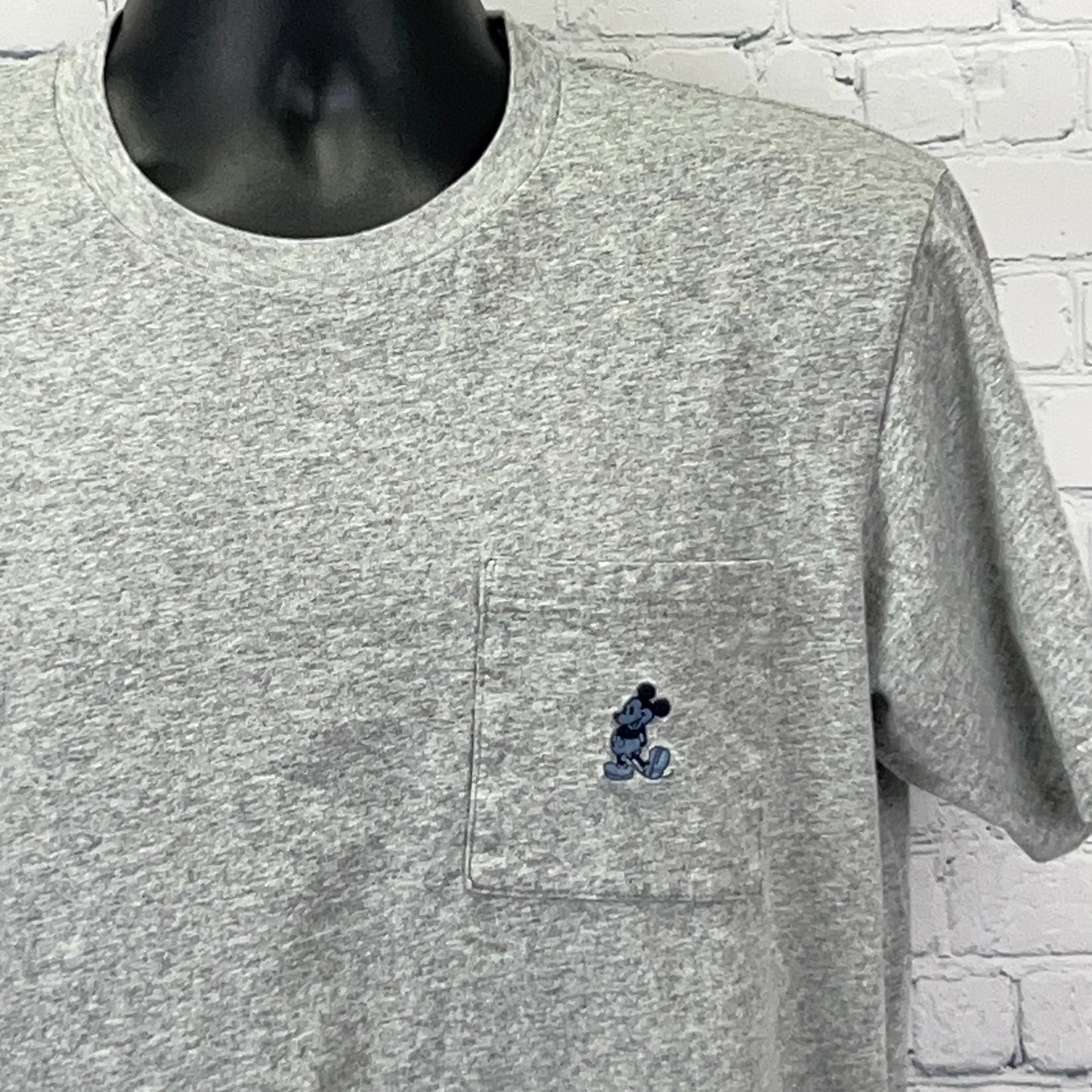 Grey Uniqlo T-shirt with Mickey Mouse embroidered pocket detail, size large, front view