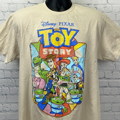 Cream Disney Pixar Toy Story T-shirt featuring colorful characters in a front view design