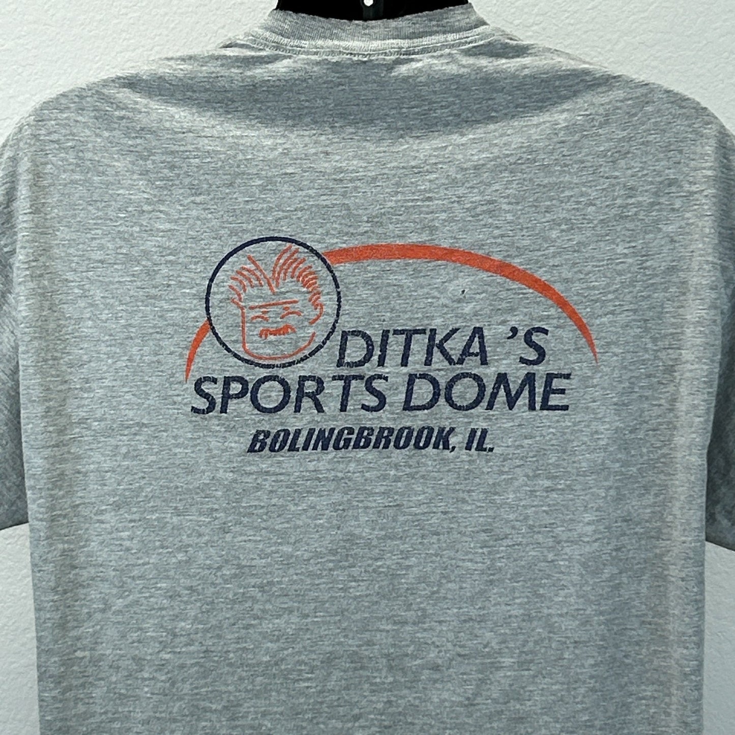 Back view of Hanes gray T-shirt featuring Mike Ditka's Sports Dome logo in Bolingbrook, IL