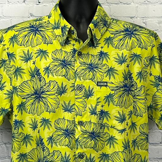 Dixxon Flannel short-sleeve shirt in vibrant yellow with blue floral and leaf patterns, featuring logo on chest