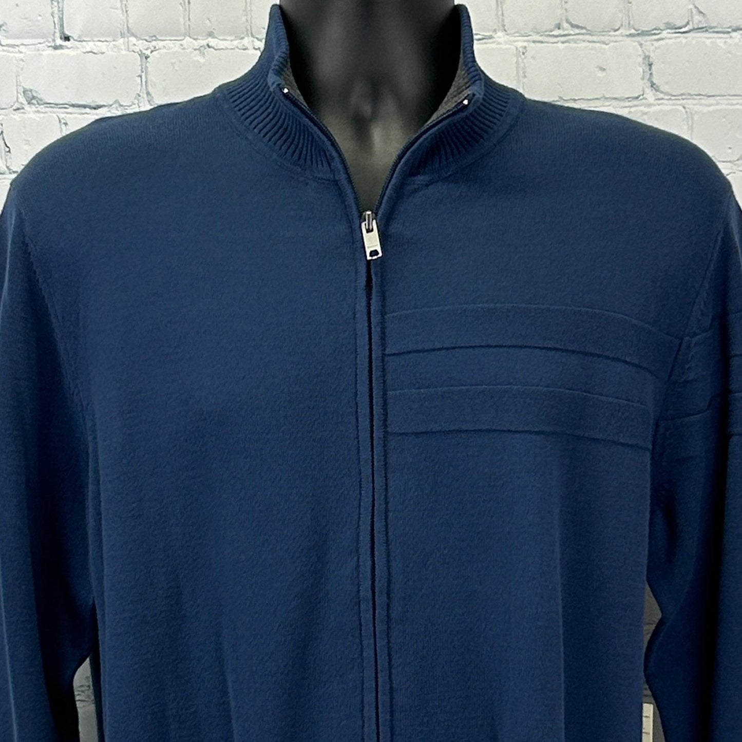 DKNY Sweater in navy blue with a zip front and subtle logo detailing on the chest