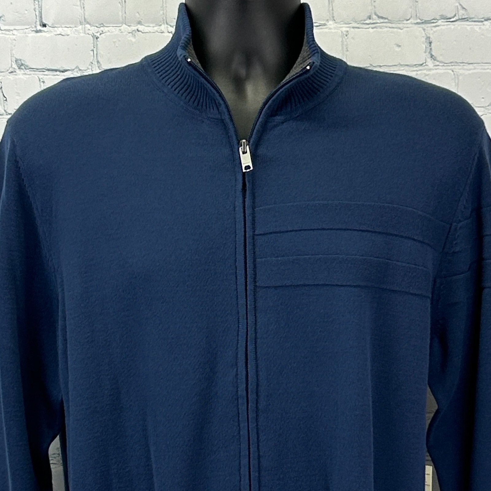 DKNY Sweater in navy blue with a zip front and subtle logo detailing on the chest
