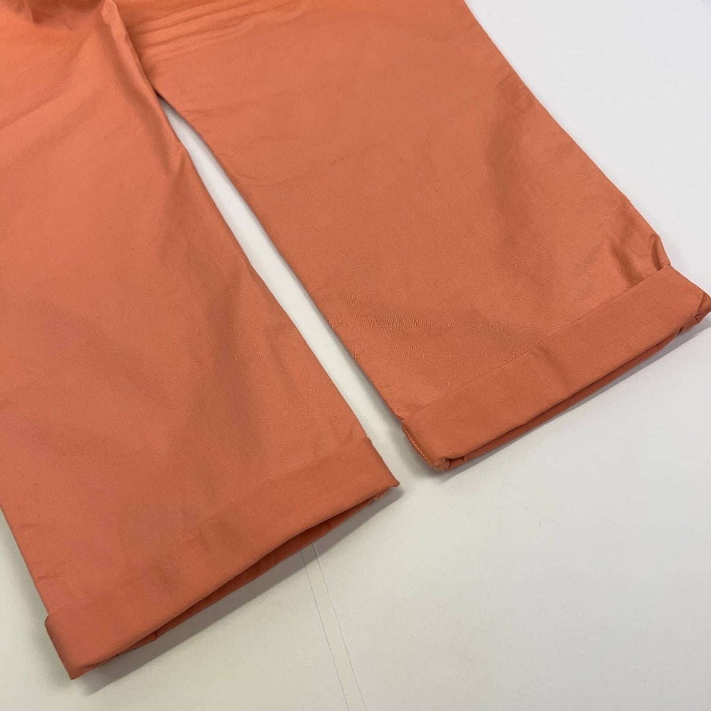 Dockers chino pants in coral color with a relaxed fit, cropped view from the front