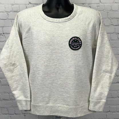 Light gray Dogwalkers Cannabis sweatshirt featuring a round logo on the front for a stylish, relaxed fit