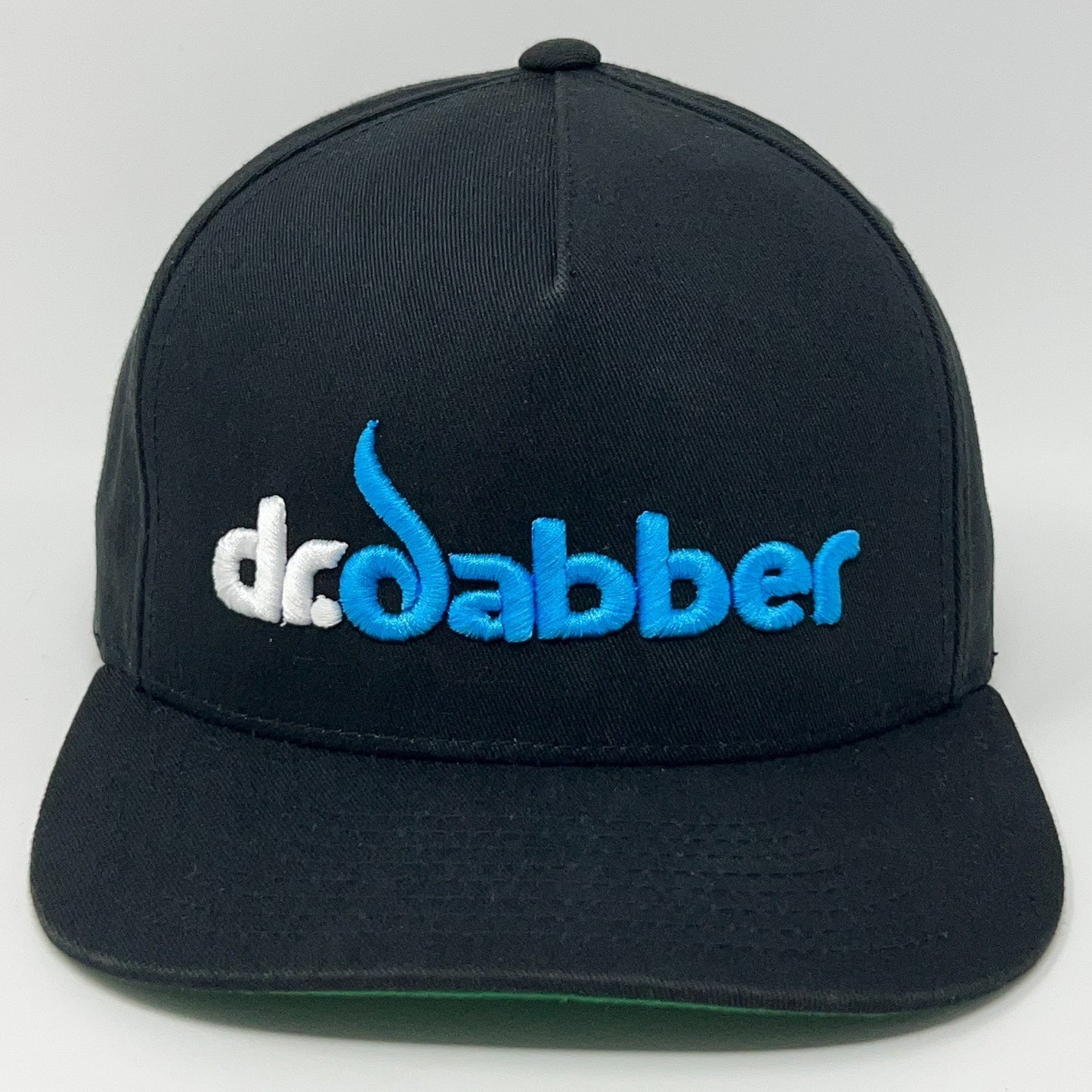 Front view of black Yupoong cap featuring embroidered Dr Dabber logo in blue and white