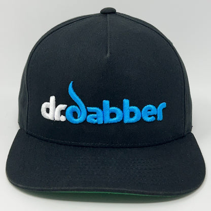 Front view of black Yupoong cap featuring embroidered Dr Dabber logo in blue and white