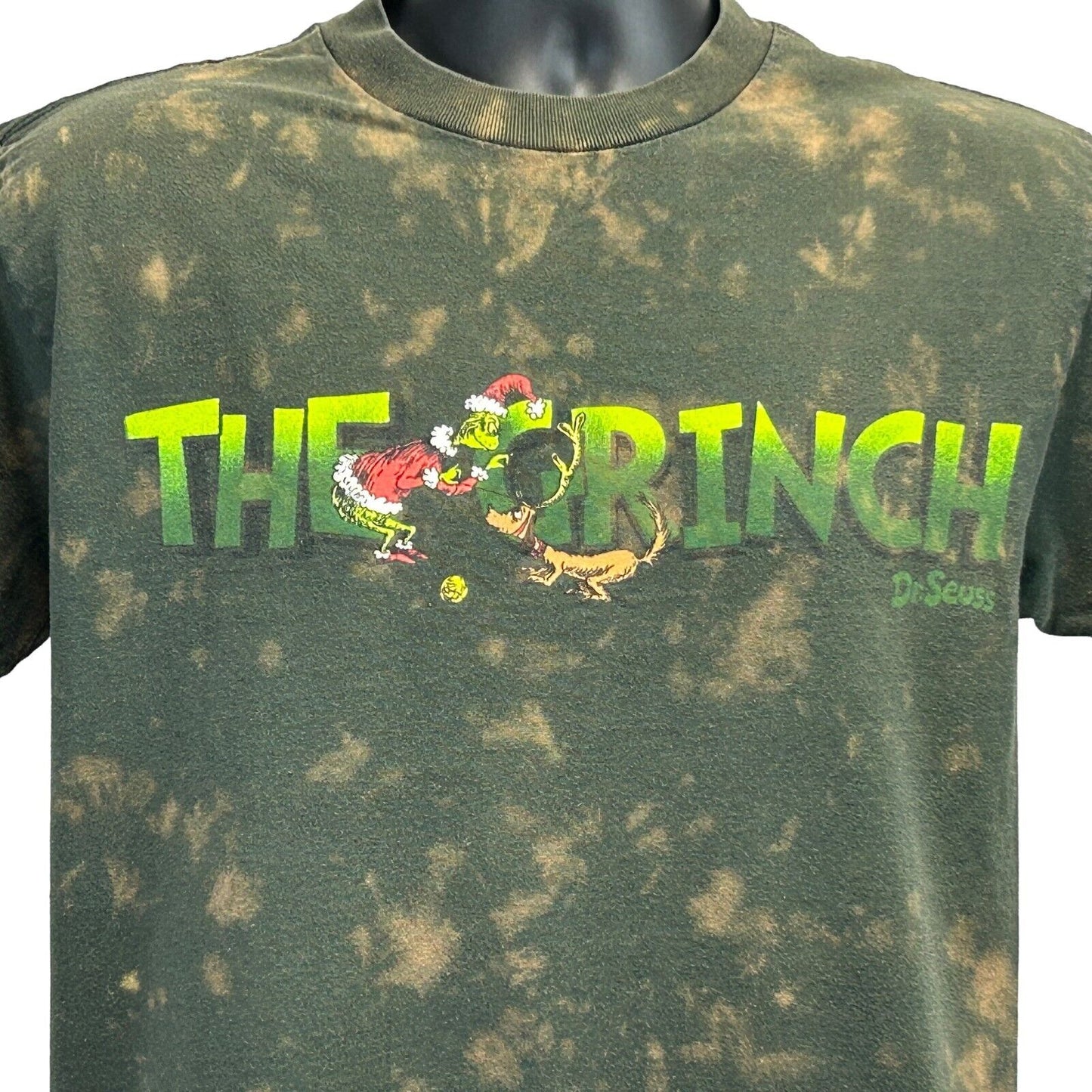 Dr Seuss The Grinch T-Shirt in green with a tie-dye design, featuring Grinch artwork on the front