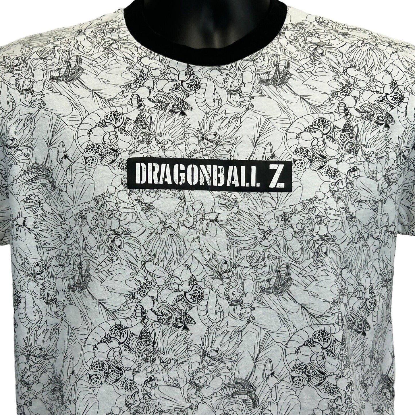Front view of Dragon Ball Z t-shirt in white with black detailing and logo, featuring a unique character design