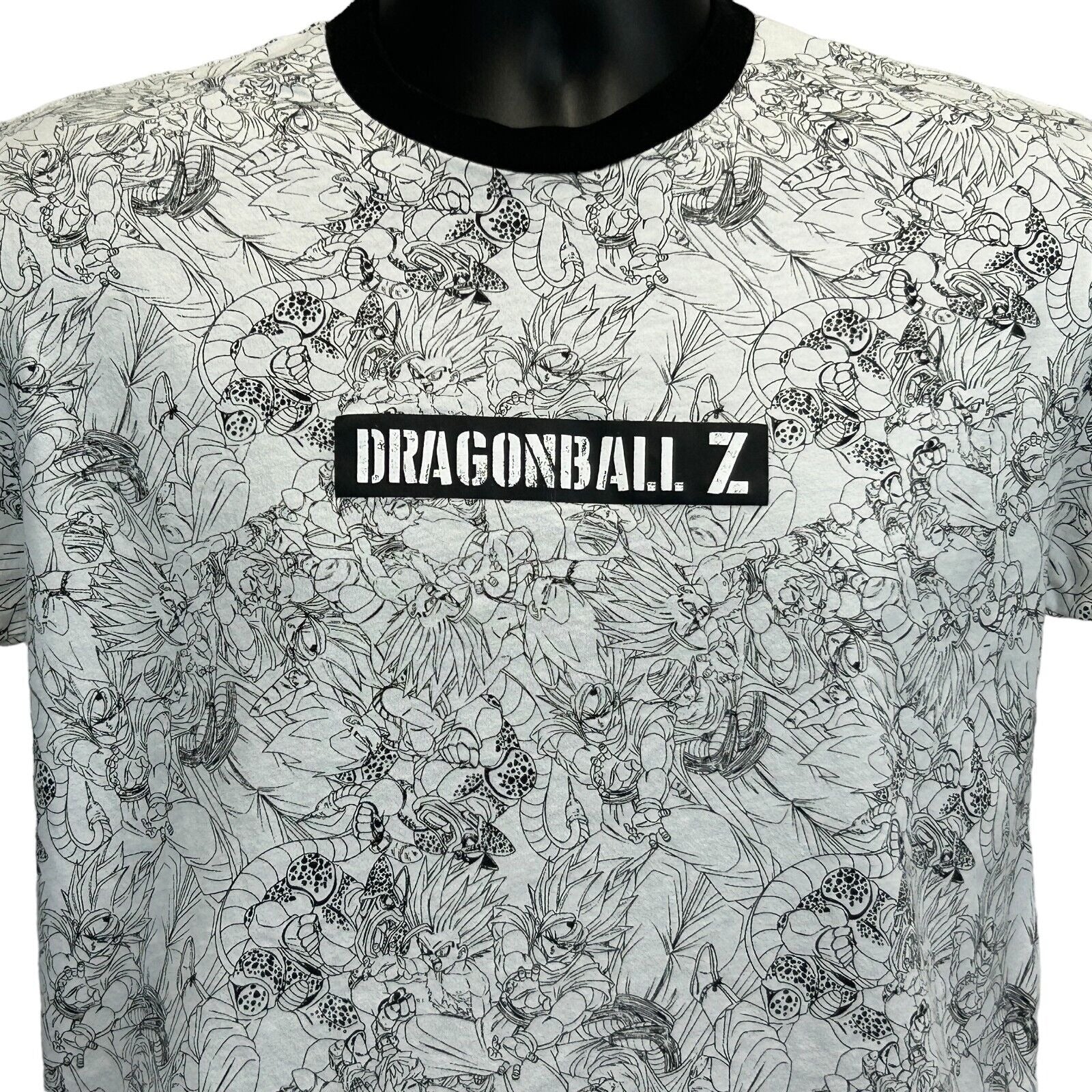 Front view of Dragon Ball Z t-shirt in white with black detailing and logo, featuring a unique character design