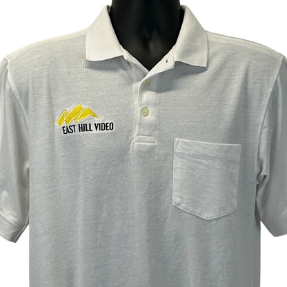 Light gray Harriton polo shirt with East Hill Video logo and front pocket detail