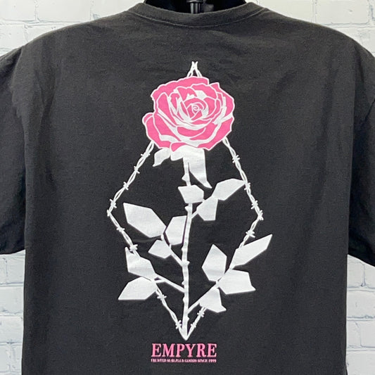 Empyre T Shirt in black featuring a pink rose graphic on the back with thorn details