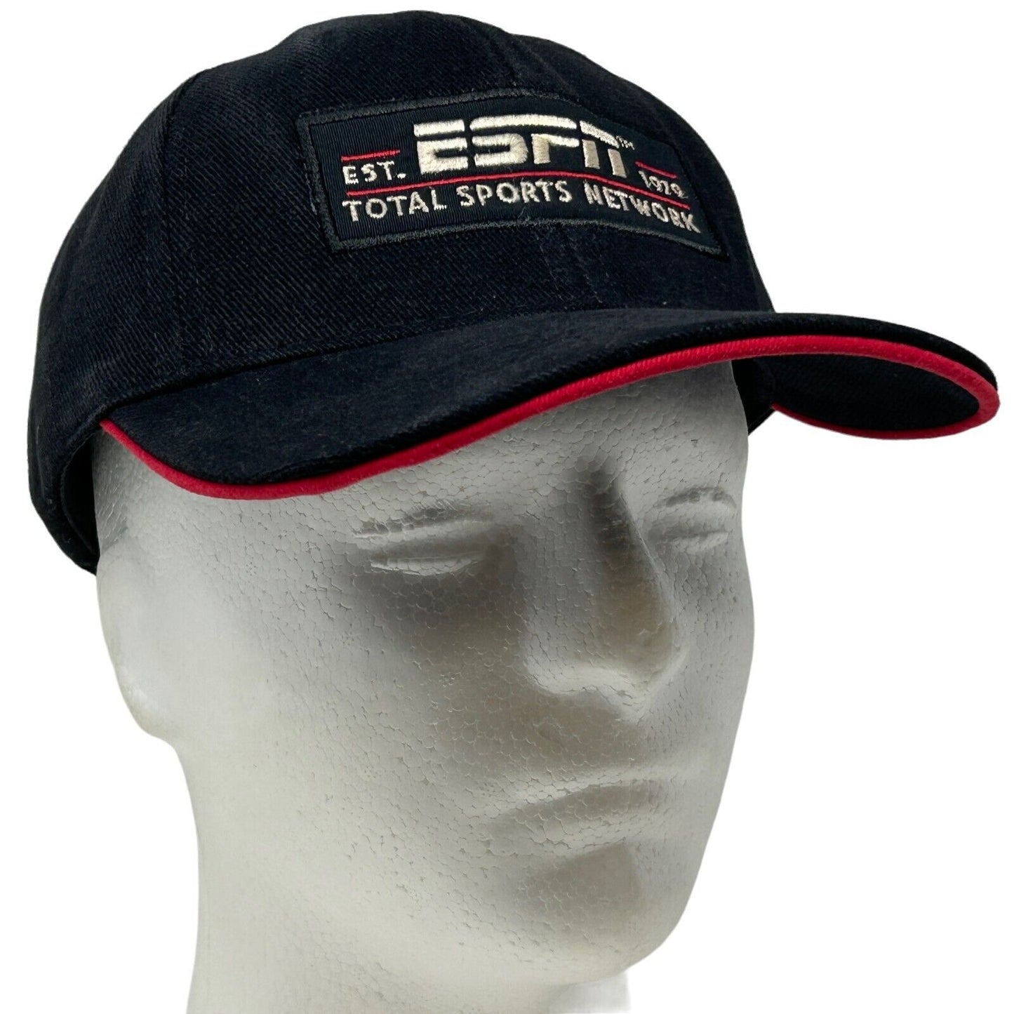 Black ESPN baseball cap with red accents, front view featuring logo and text detail