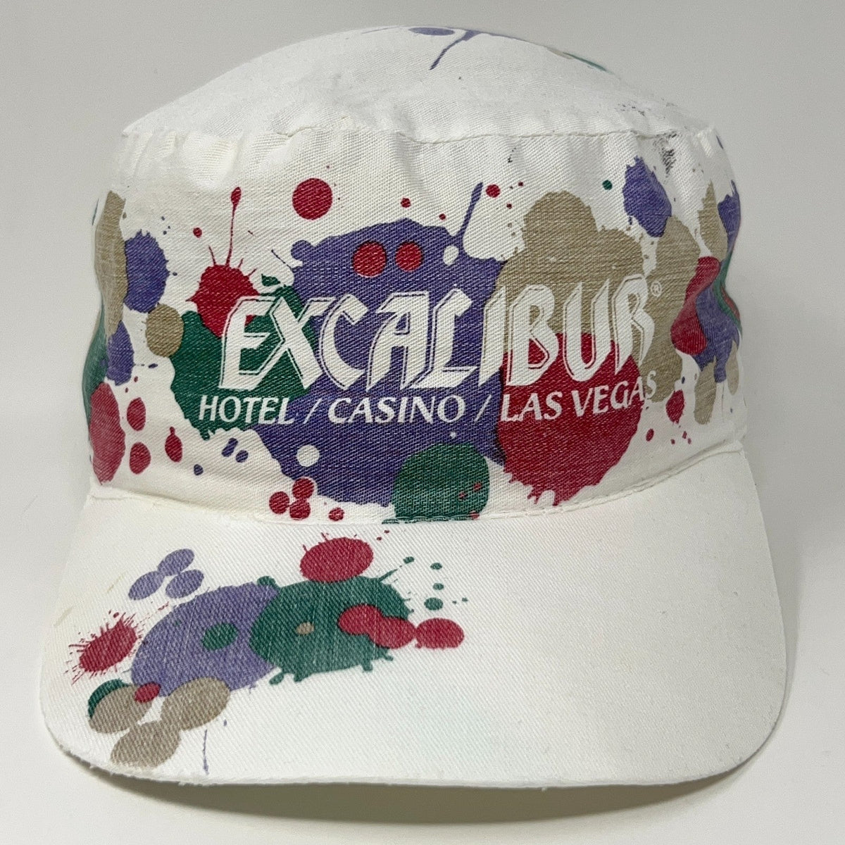 Vintage Excalibur Casino hat in white with colorful paint splatter design