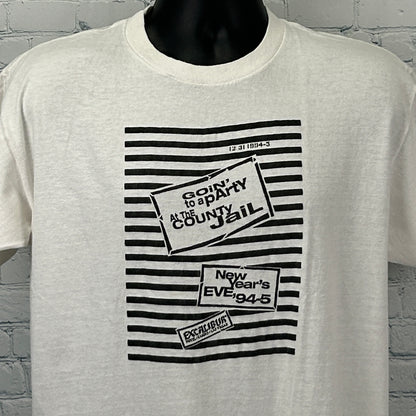 Vintage white T-shirt featuring Excalibur Las Vegas graphic with jail party theme, front view