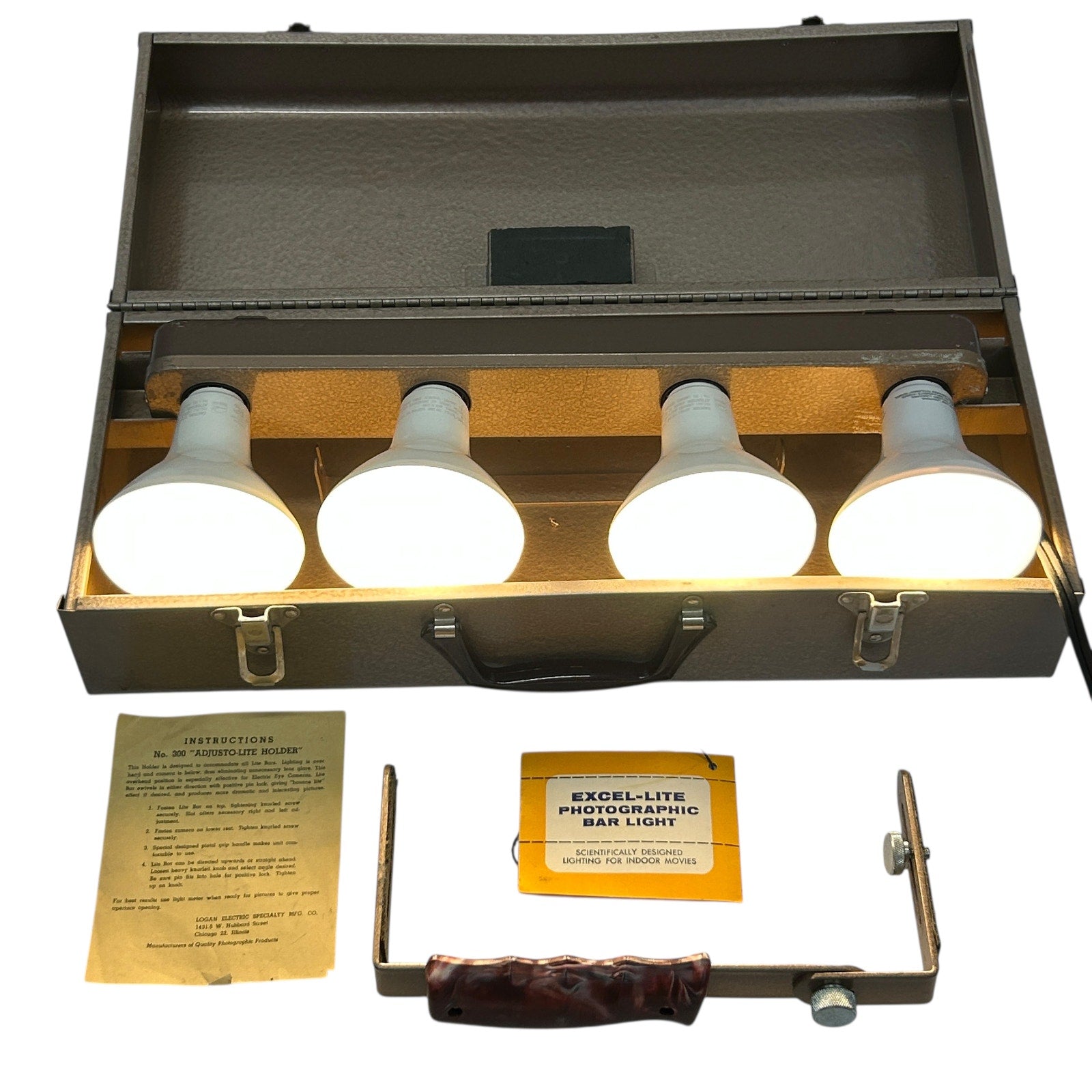 Excel Movie Camera 4 Light Bar in a compact case with four white bulbs and user instructions