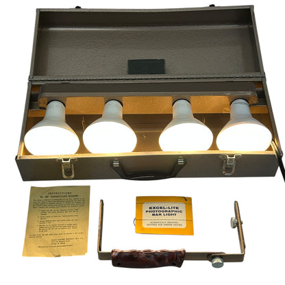 Excel Movie Camera 4 Light Bar in a compact case with four white bulbs and user instructions