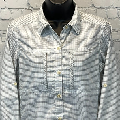 Front view of ExOfficio Shirt in light blue checkered pattern with button details and chest pockets