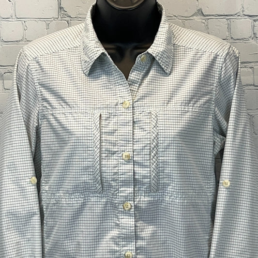 Front view of ExOfficio Shirt in light blue checkered pattern with button details and chest pockets