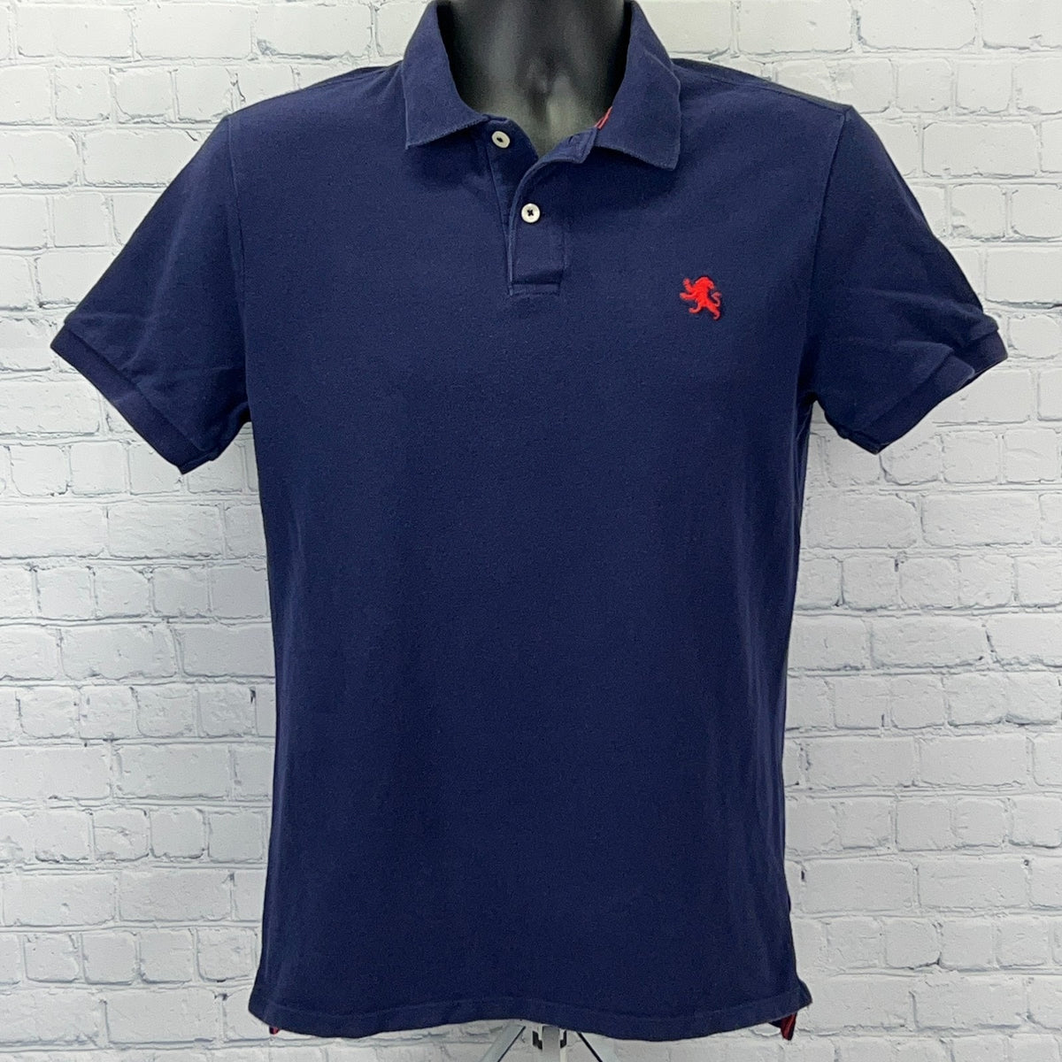 Express navy blue polo shirt in size small featuring a red lion logo on the chest