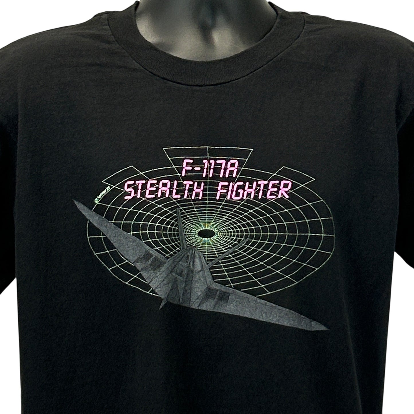 Black Vintage T-Shirt featuring F-117A Stealth Fighter graphic on the front in bright colors