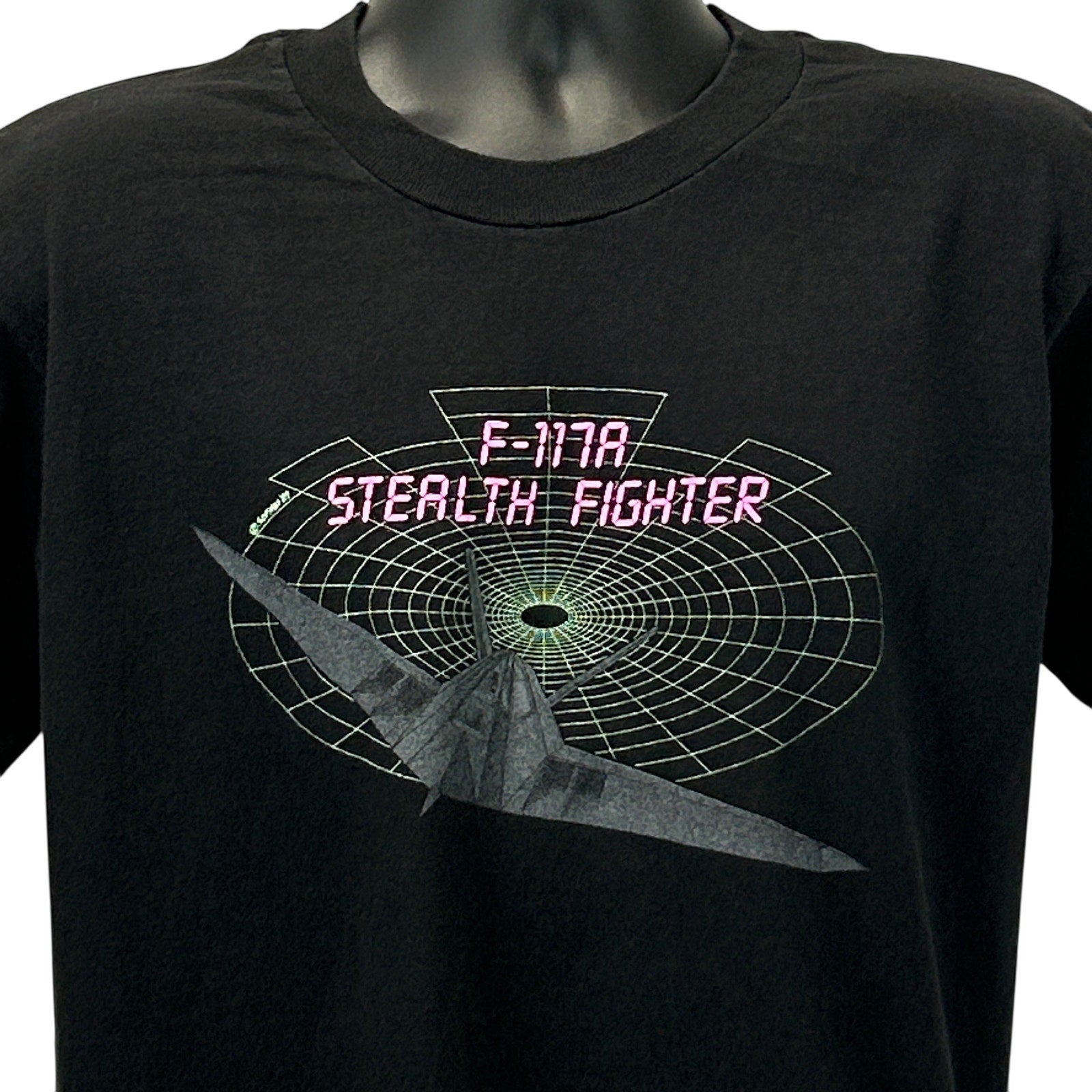 Black Vintage T-Shirt featuring F-117A Stealth Fighter graphic on the front in bright colors