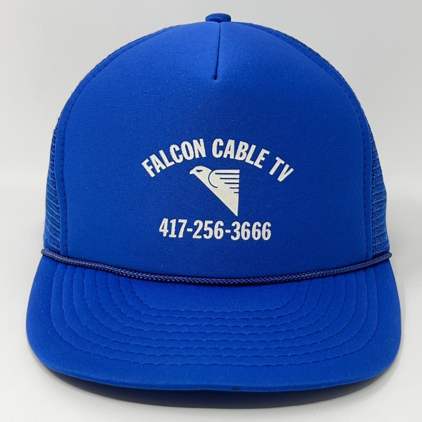 Vintage Trucker Hat in blue with Falcon Cable TV logo and phone number on the front view