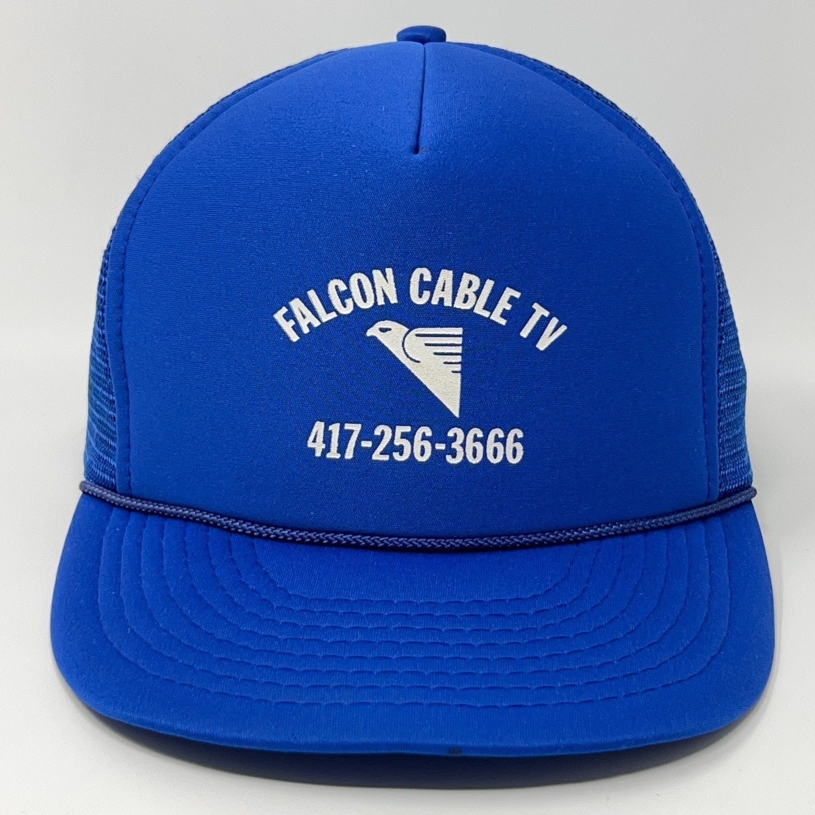 Vintage Trucker Hat in blue with Falcon Cable TV logo and phone number on the front view