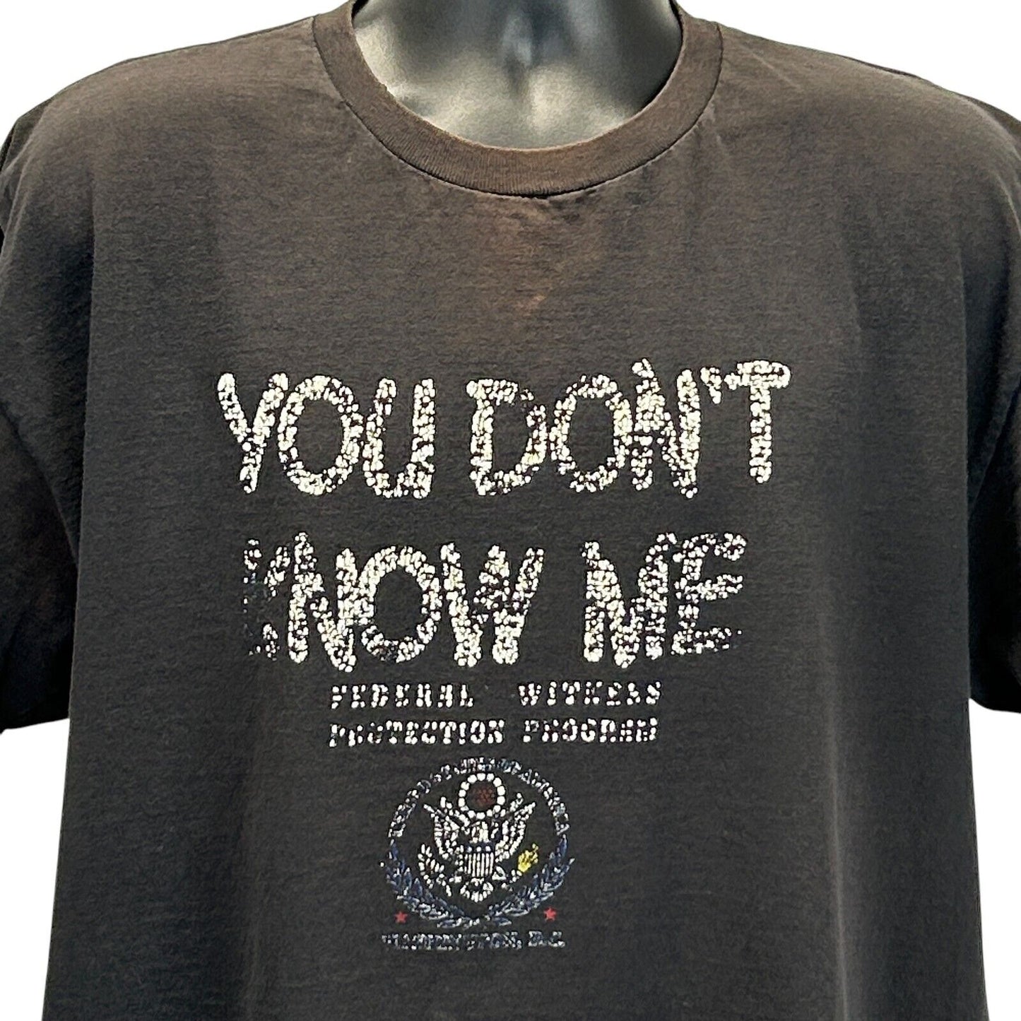 Delta T-Shirt in Black featuring 'You Don't Know Me' text and Witness Protection Program logo in front view