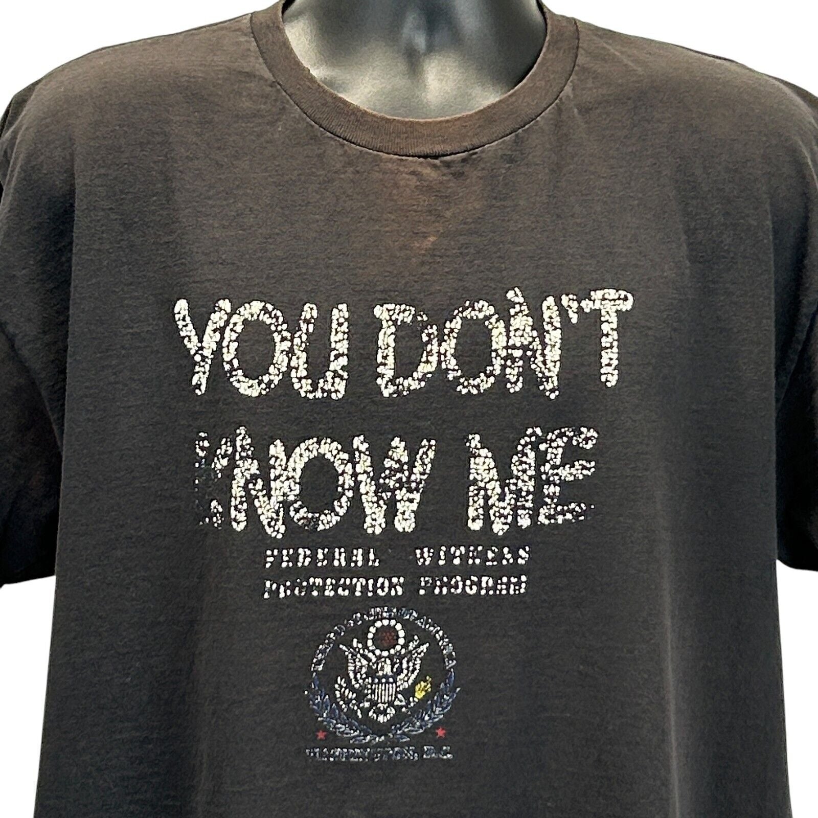 Delta T-Shirt in Black featuring 'You Don't Know Me' text and Witness Protection Program logo in front view
