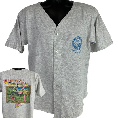 Vintage gray T-shirt featuring a Private Investigator graphic on the back and a flamingo design on the front