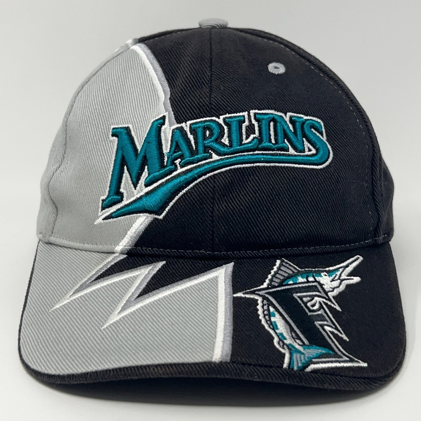 Black Miami Marlins cap with teal logo and grey accents showcasing front view and detailed stitching