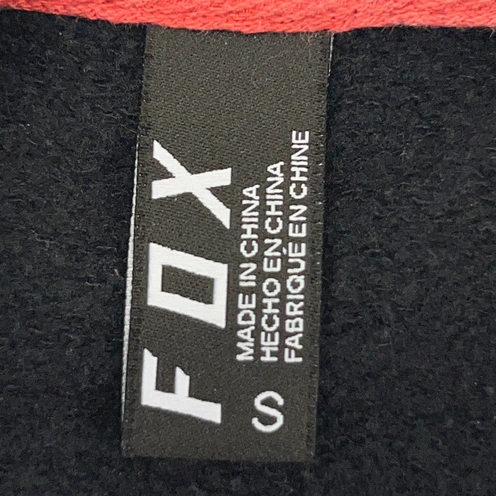 Fox jacket in black and red, front view featuring a classic label