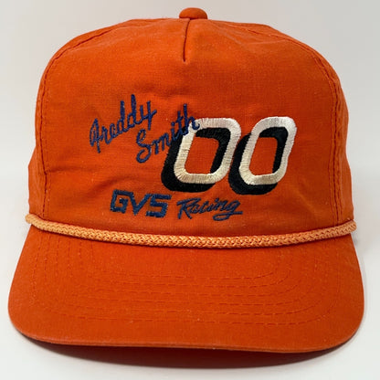 Vintage Freddy Smith orange cap with embroidered logo and racing details on the front view